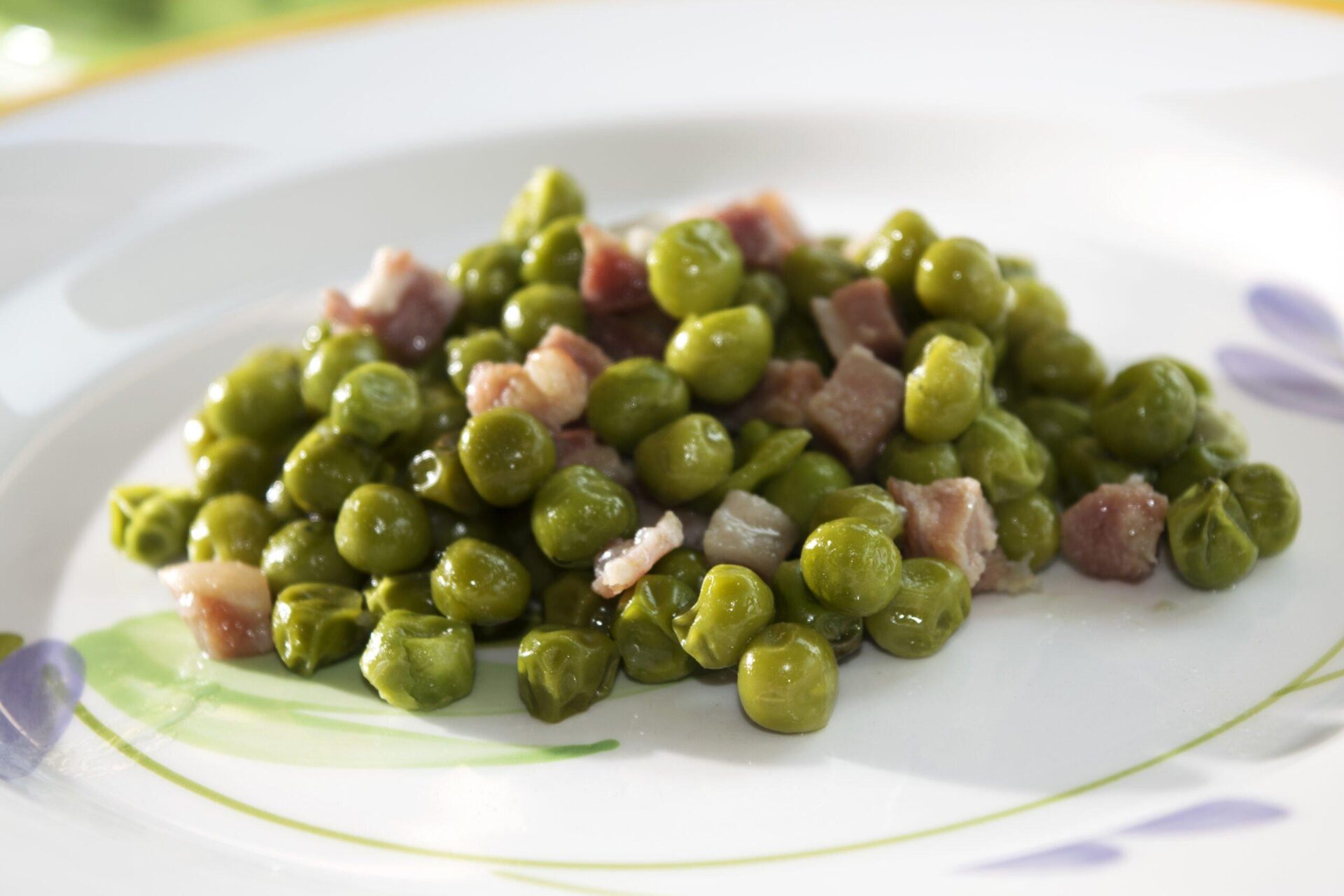 Peas with Ham: A Spanish Classic with Green Peas and Savory Ham