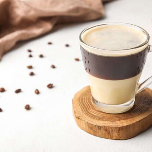 Glass,Cup,Of,Delicious,Cafe Bombon,On,Light,Table